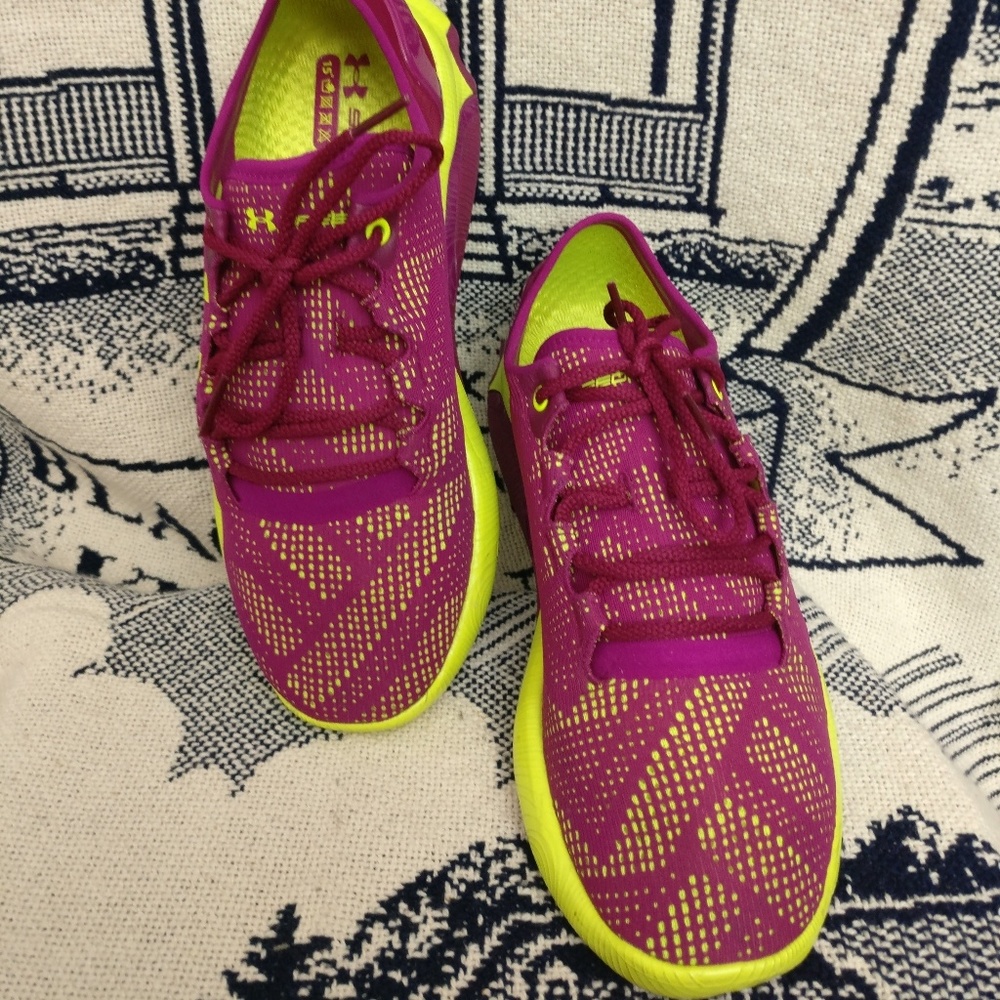 Burgundy and yellow under armour sneakers